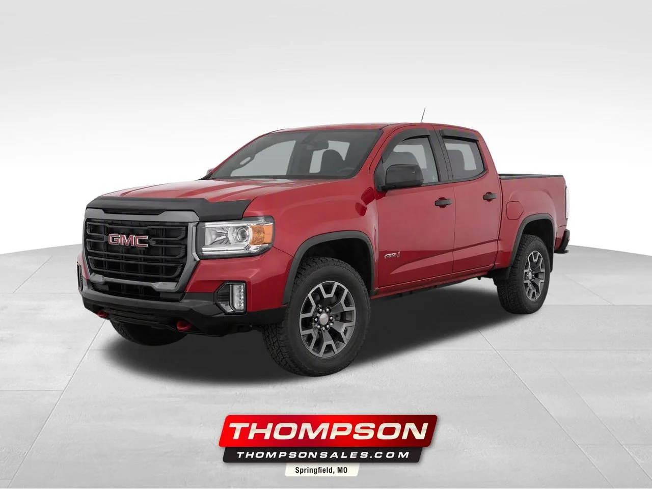 Used 2021 CAYENNE RED TINTCOAT GMC 4WD AT4 w/Cloth image 1
