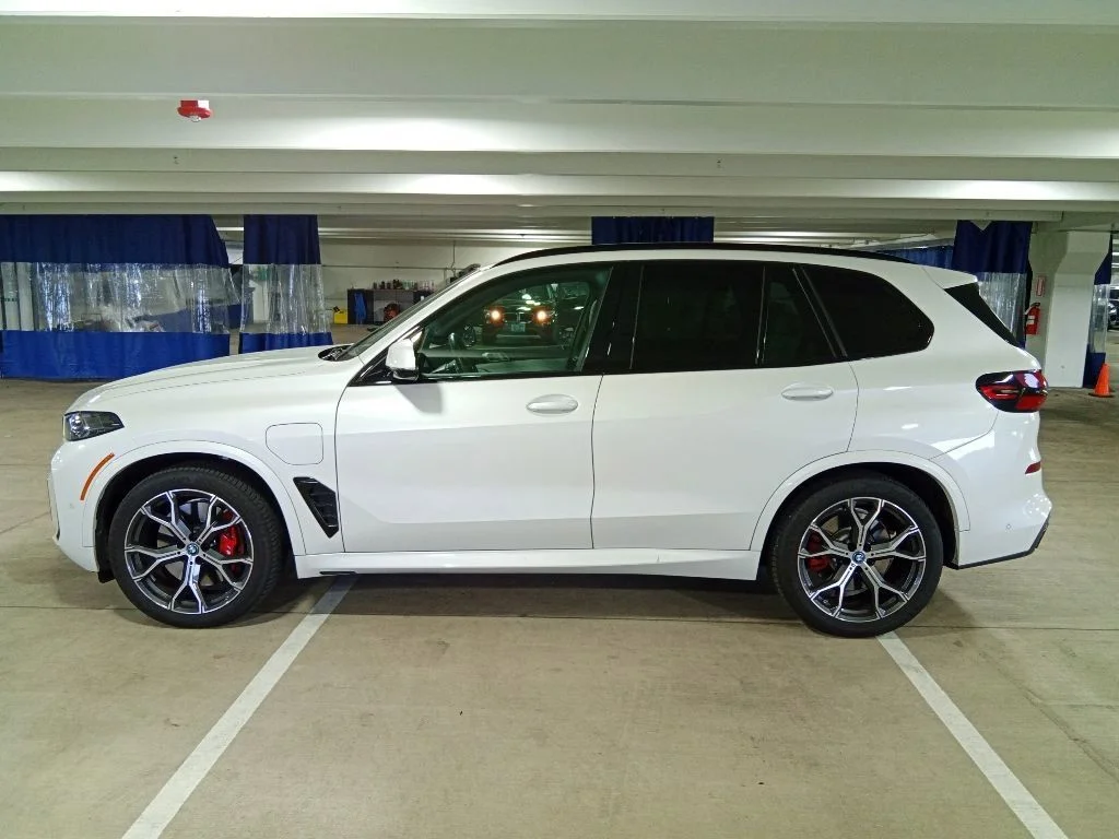 Used 2025 Mineral White Metallic BMW xDrive50e image 8
