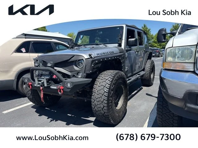 Used 2014 Silver Jeep Unlimited Rubicon image 1