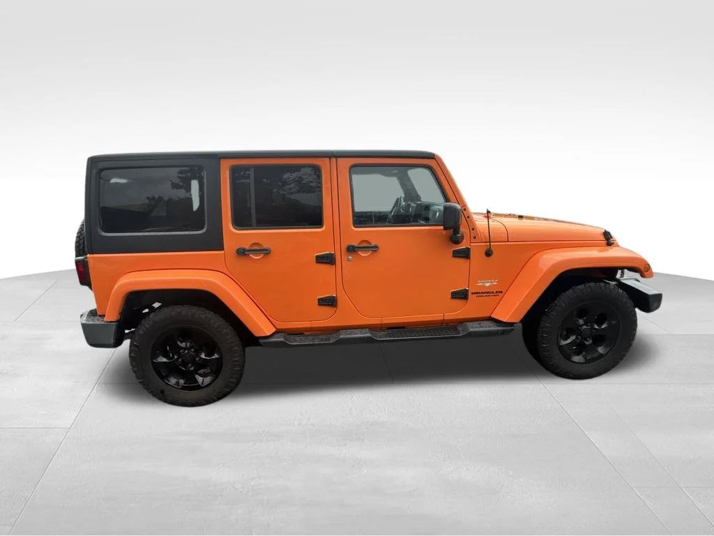 Used 2013 Orange Jeep Unlimited Sahara image 16