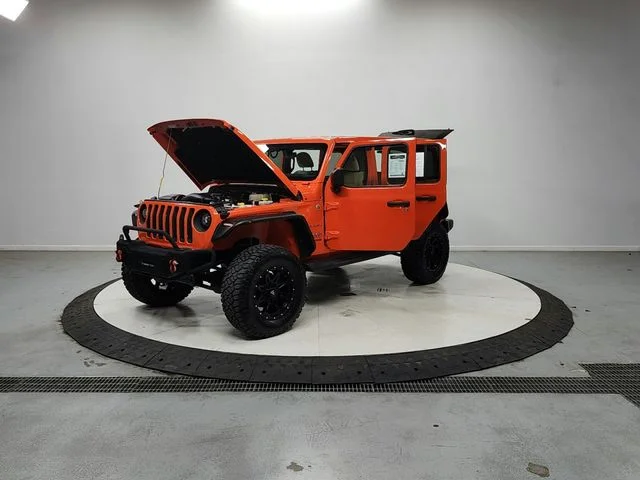 Used 2018 Orange Jeep Unlimited Sahara image 11