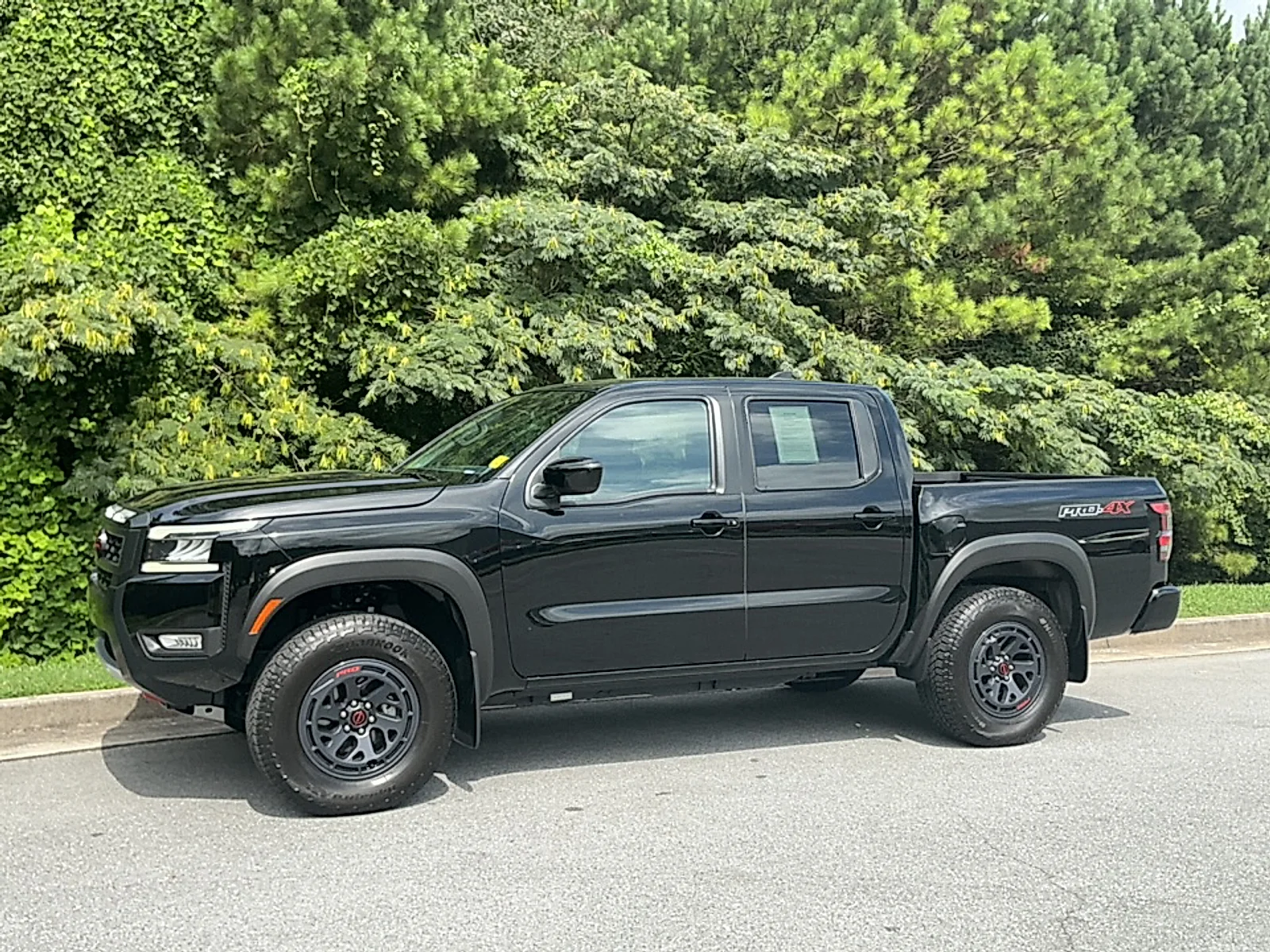 Used 2025 Super Black Nissan Crew Cab PRO-4X 4x4 image 4