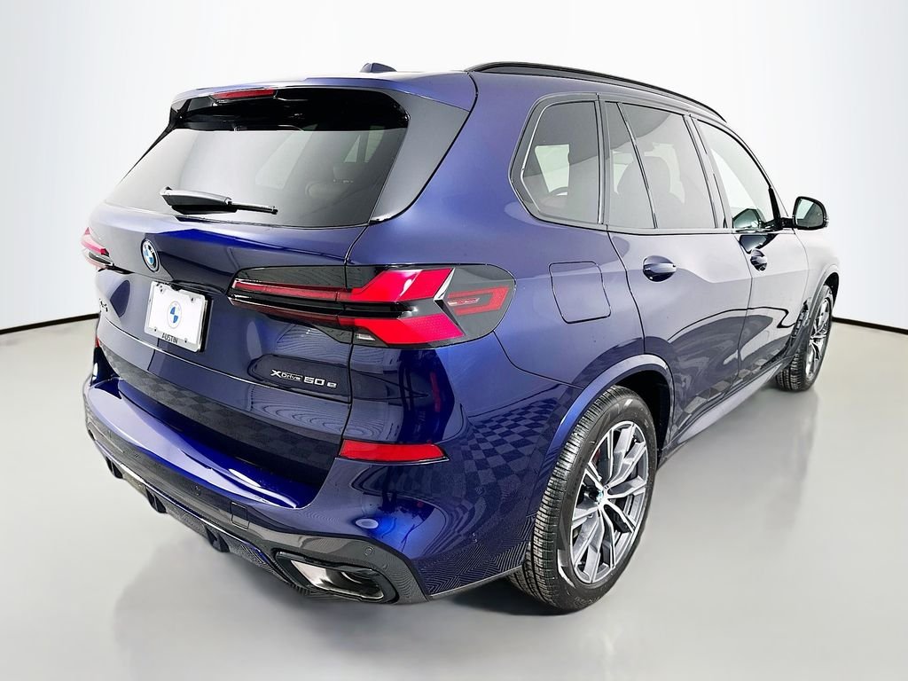 Used 2026 Tanzanite Blue II Metallic BMW xDrive50e image 5
