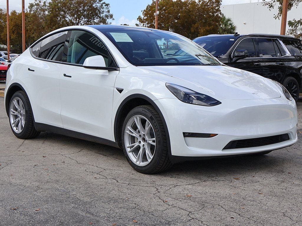 Used 2023 Tesla Model Y Base with VIN 7SAYGDED9PF956853 for sale in Miami, FL