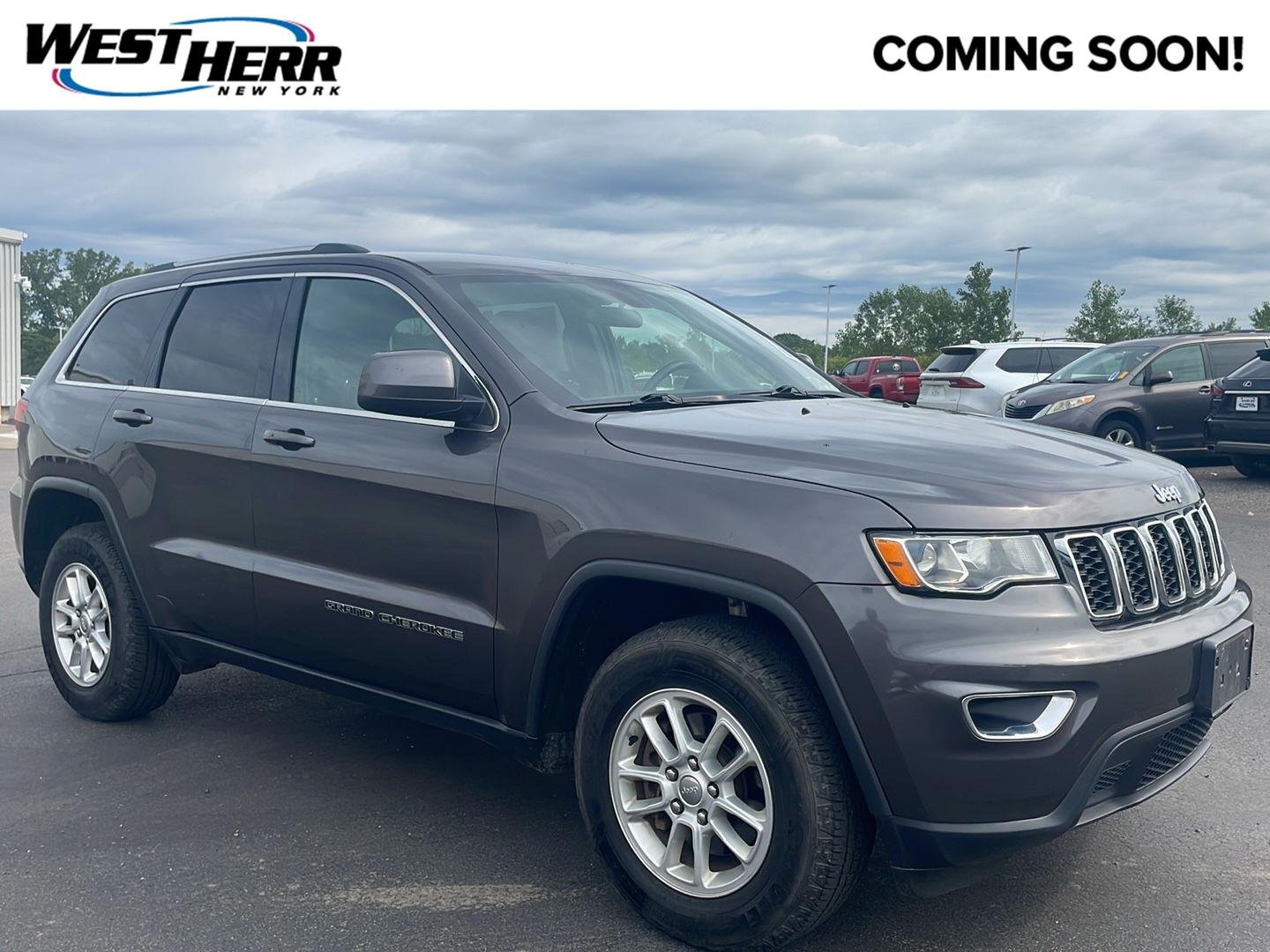 Used 2018 Granite Crystal Metallic Clearcoat Jeep Laredo E image 1