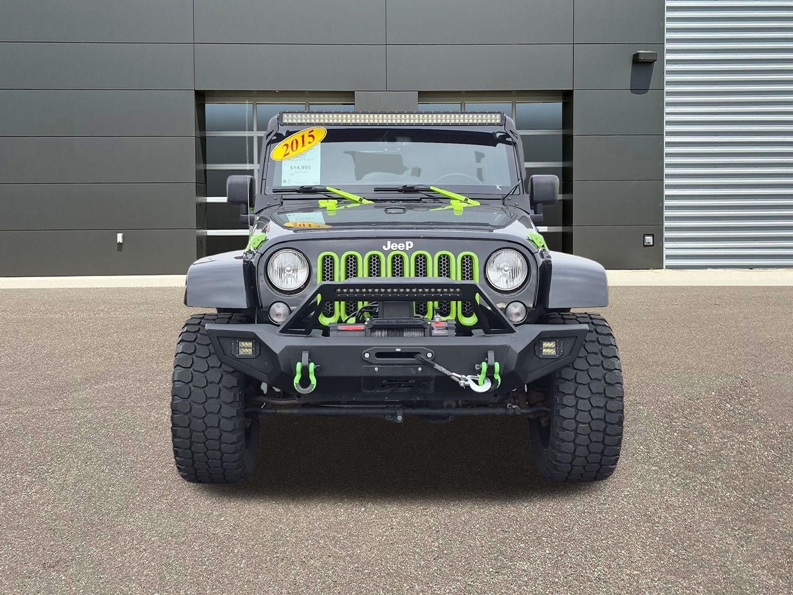 Used 2015 Black Clearcoat Jeep Sahara image 2