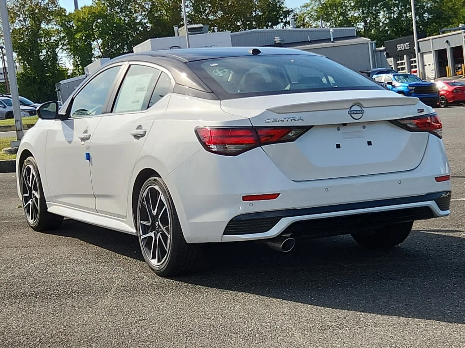 Used 2025 Aspen White Tricoat/Super Black Nissan SR image 4