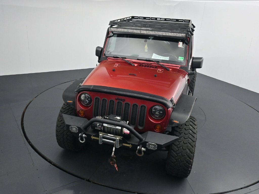 Used 2012 Red Jeep Unlimited Sport image 11
