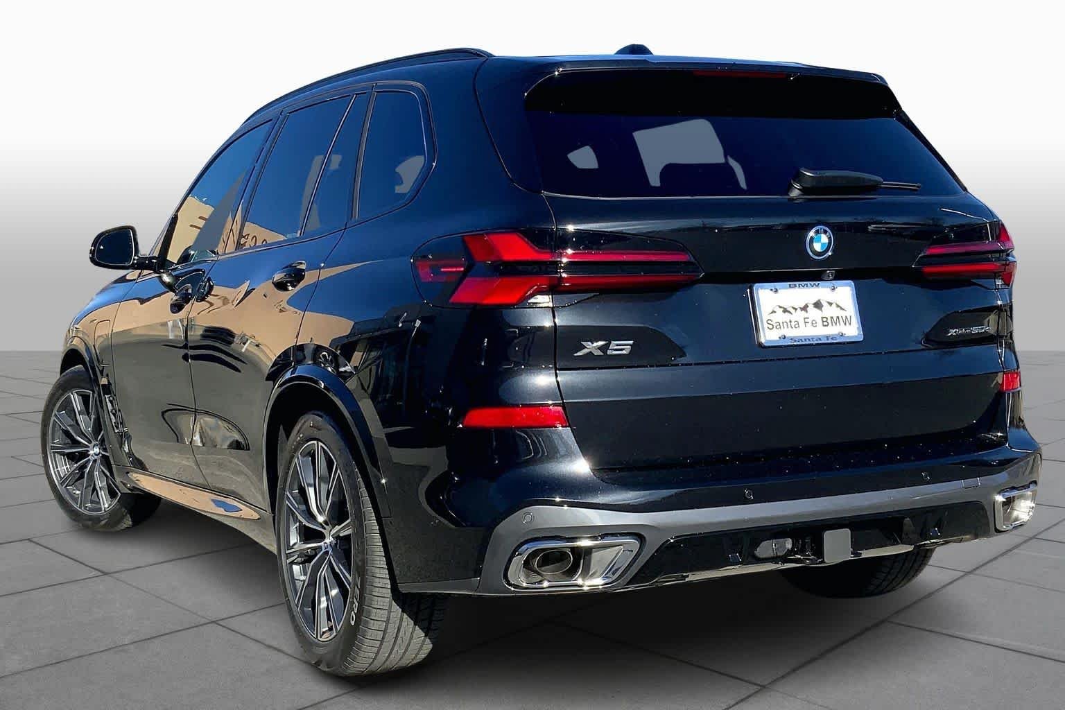 New 2026 Black Sapphire Metallic BMW xDrive50e image 12
