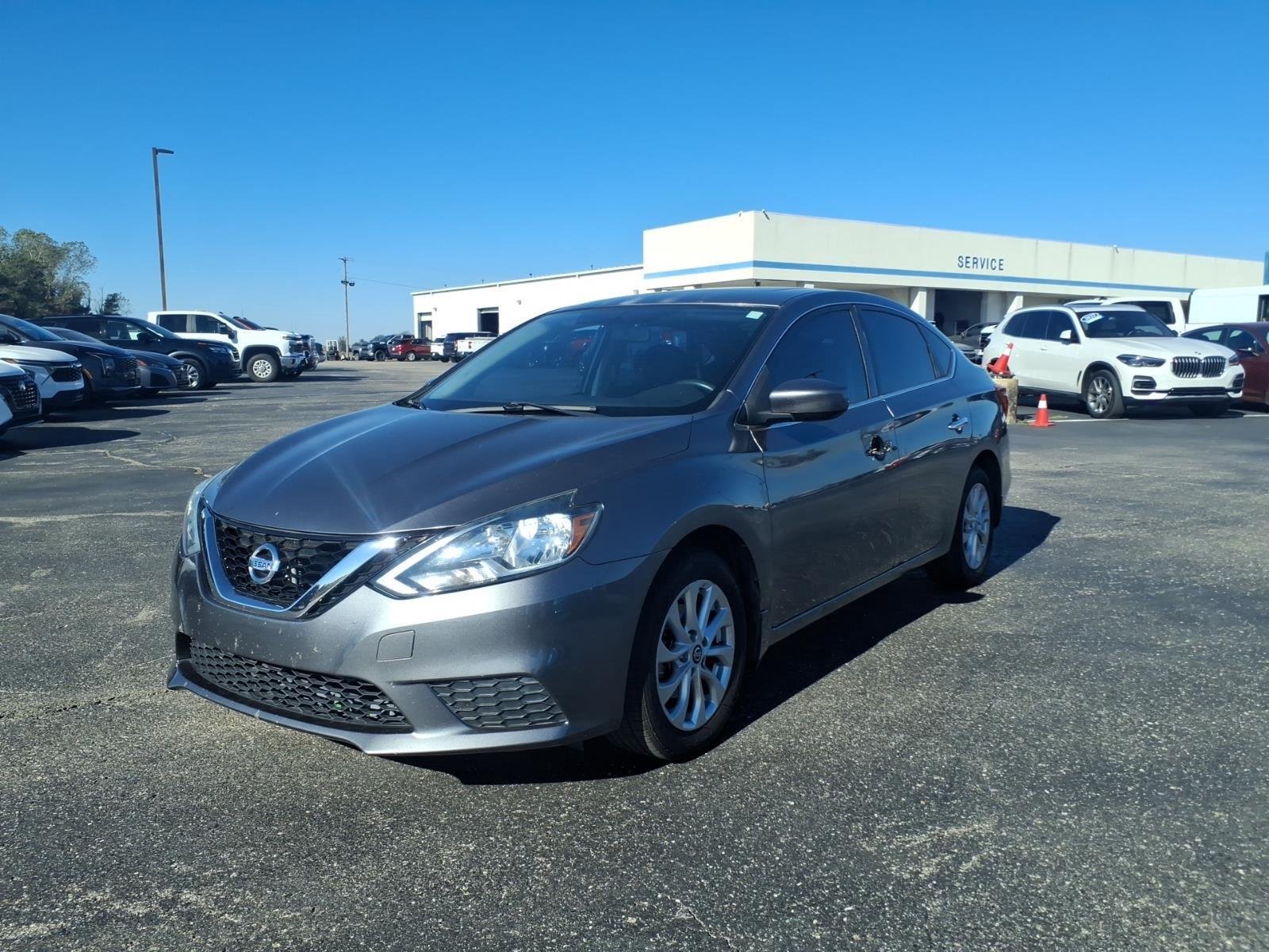 Used 2016 Gun Metallic Nissan SV image 1