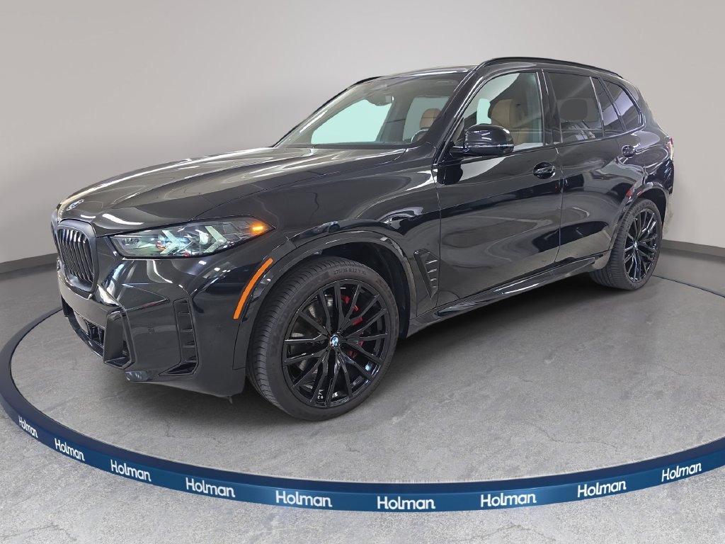 Used 2024 Black Sapphire Metallic BMW sDrive40i image 1