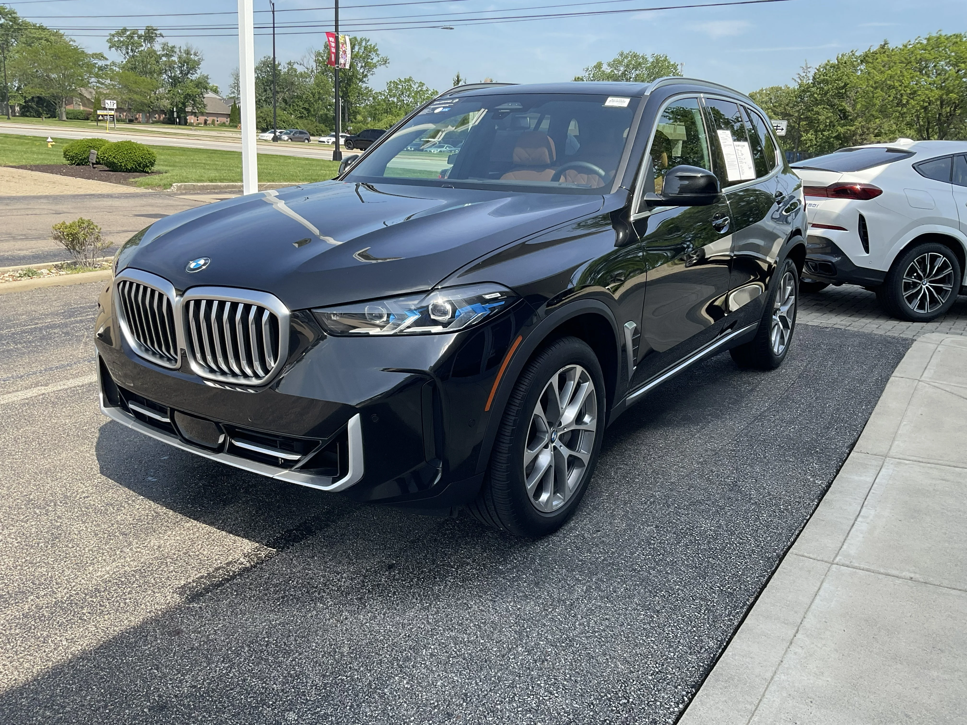 Certified Used 2024 Black Sapphire Metallic BMW xDrive40i image 3