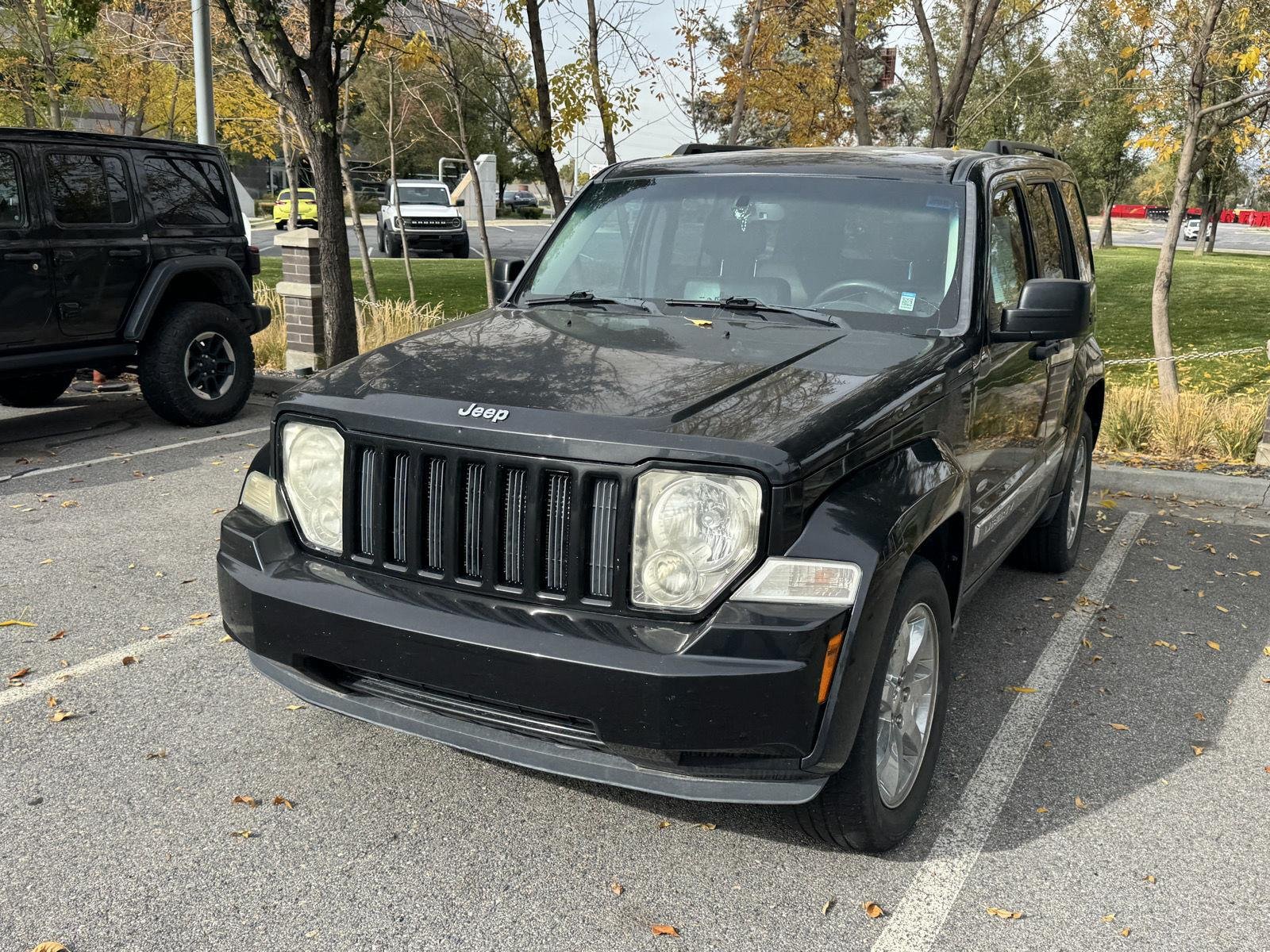 Used 2012 Brilliant Black Crystal Pearl Jeep Sport Latitude image 2