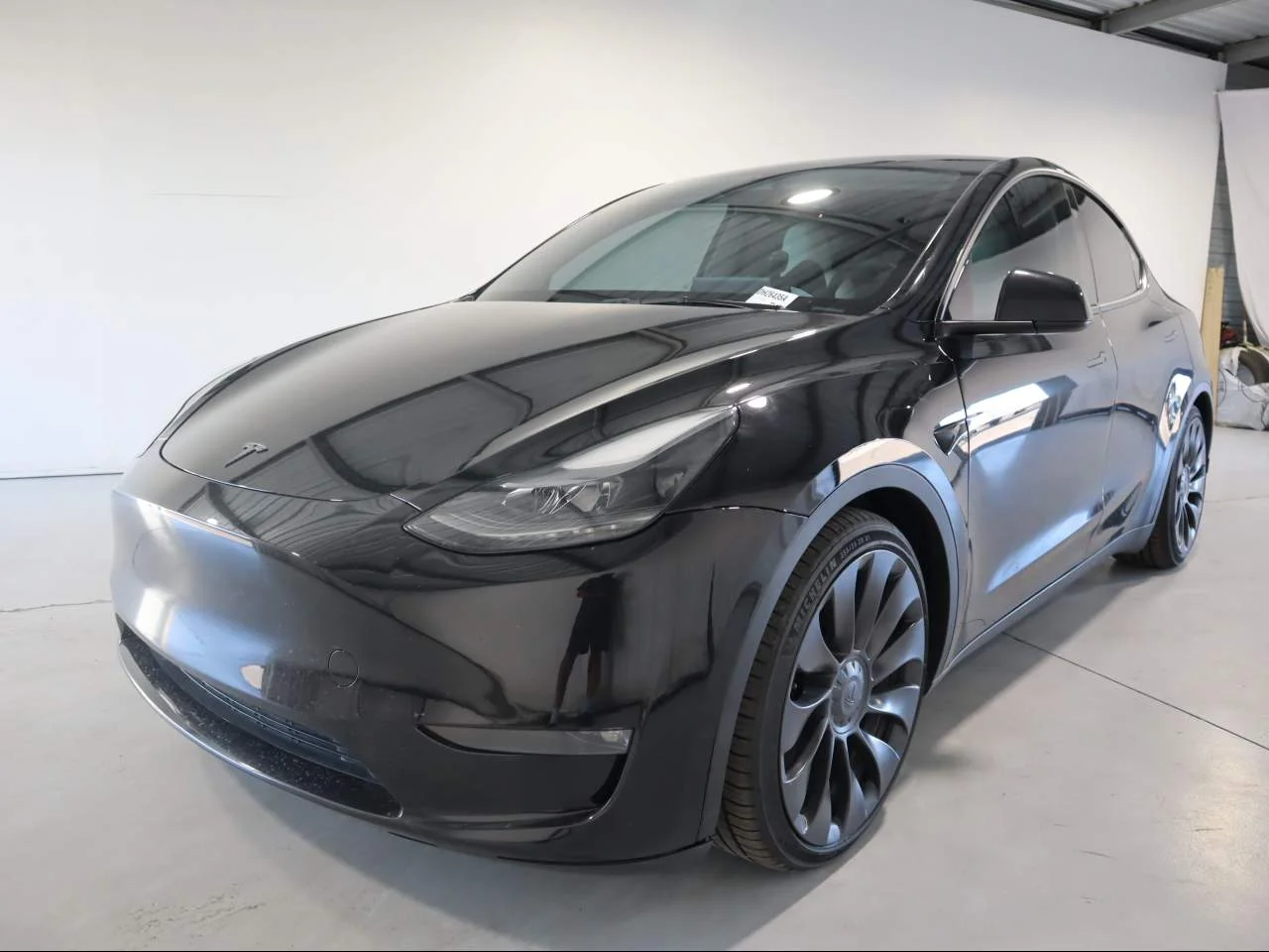 Used 2024 Solid Black Tesla Performance image 1