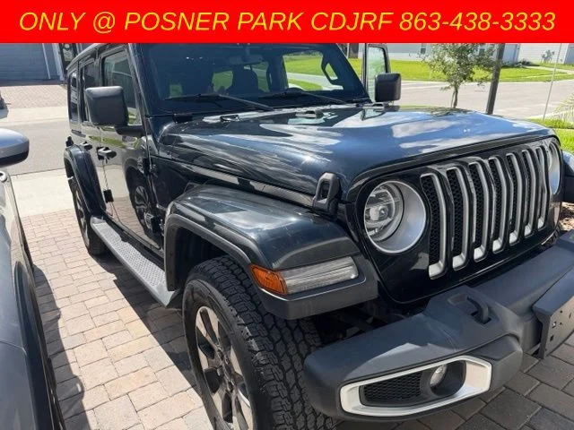 Used 2022 Black Jeep Unlimited Sahara image 1