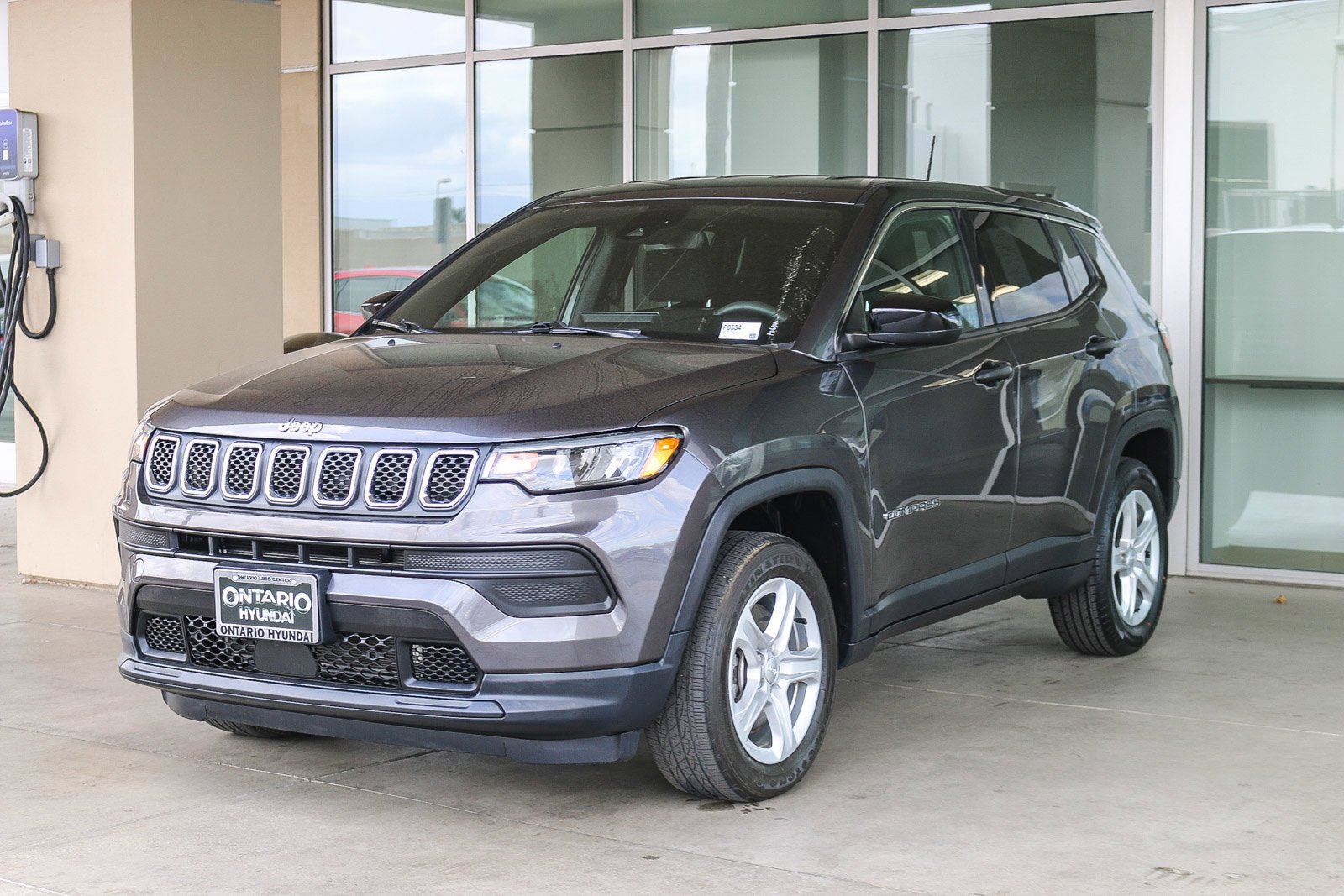 Used 2023 Granite Crystal Metallic Clearcoat Jeep Sport image 4