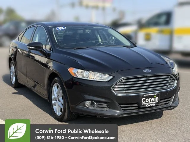 Used 2014 Tuxedo Black Metallic Ford SE image 1