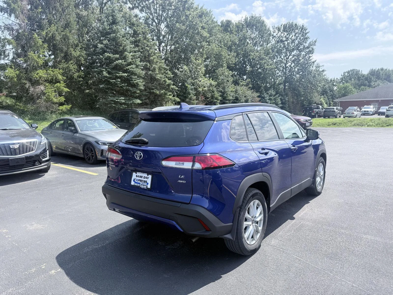 Used 2023 Blue Crush Metallic Toyota LE image 7