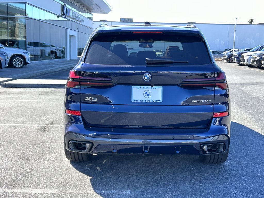 New 2026 Tanzanite Blue II Metallic BMW xDrive50e image 4