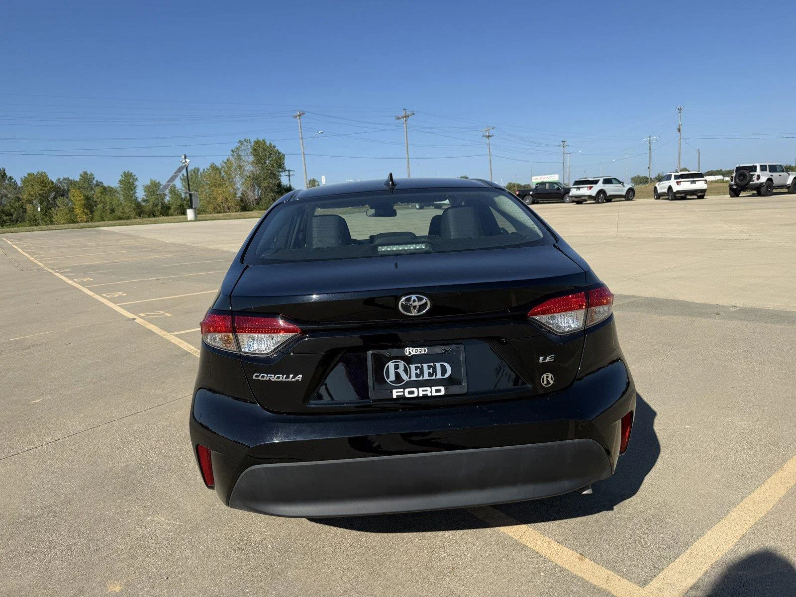 Certified Used 2025 Midnight Black Metallic Toyota LE image 8