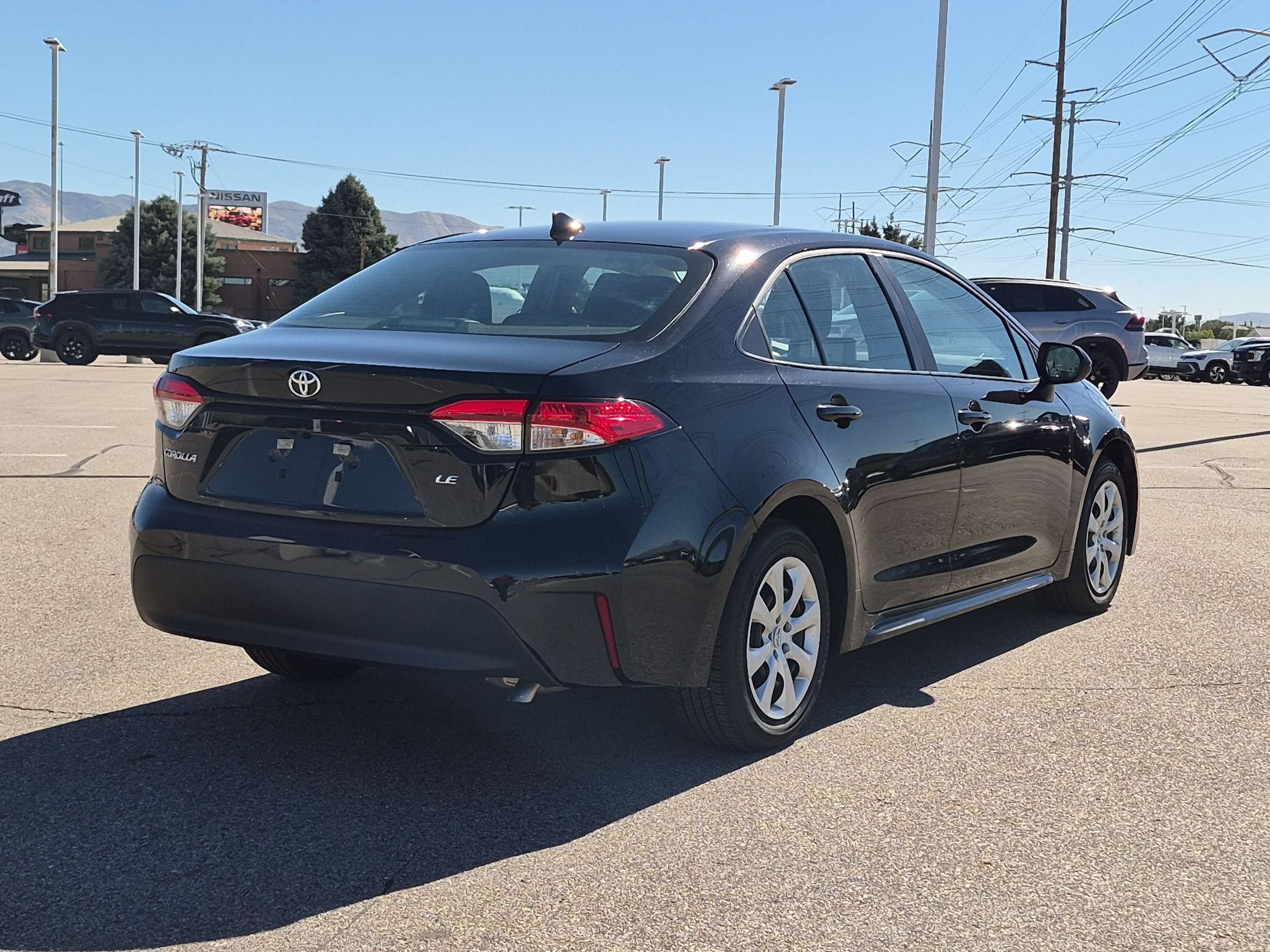 Used 2026 Midnight Black Metallic Toyota LE image 3