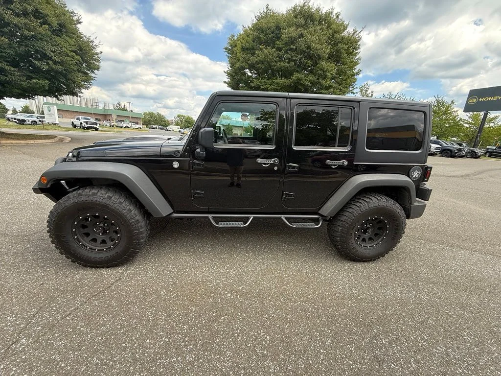 Used 2011 Black Jeep Unlimited Sport image 4