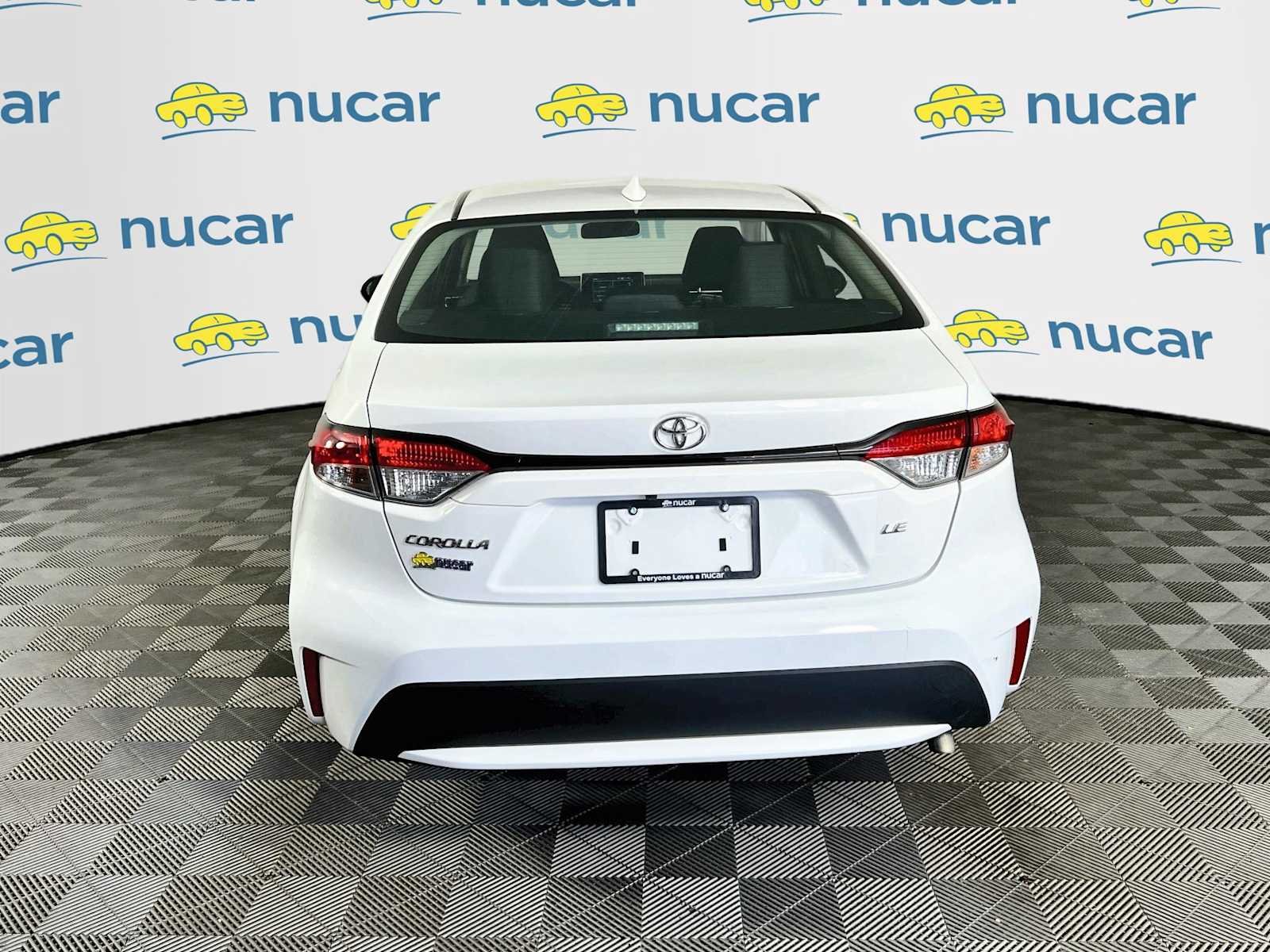 Used 2021 Super White Toyota LE image 6