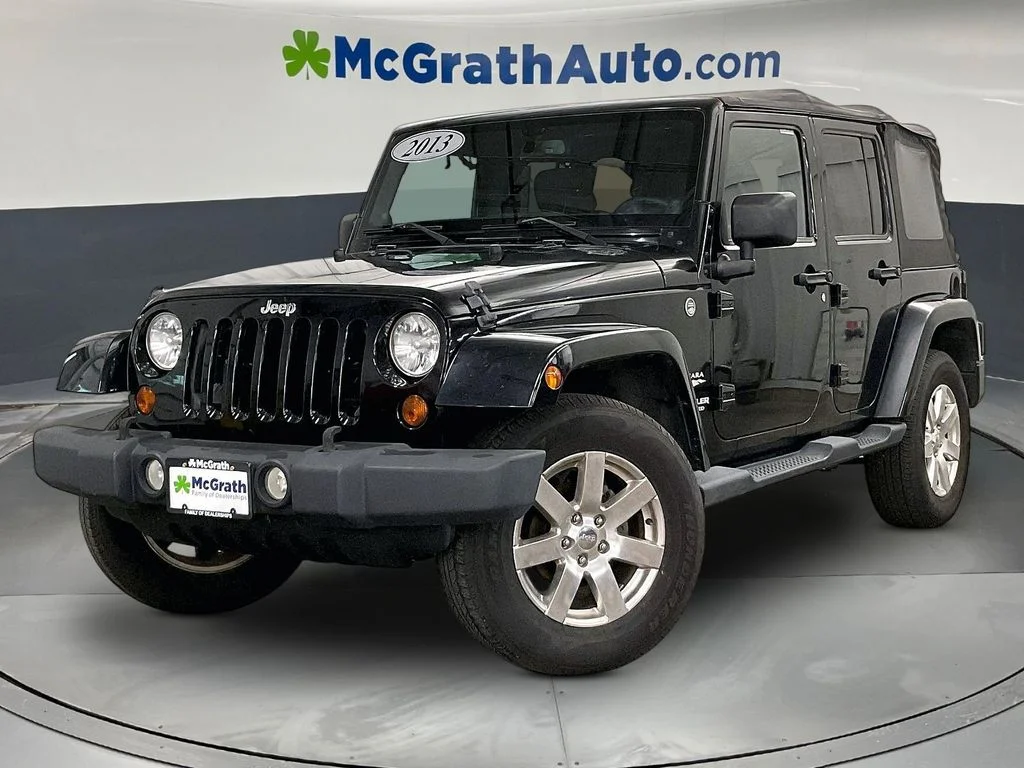 Used 2013 Black Jeep Unlimited Sahara image 2