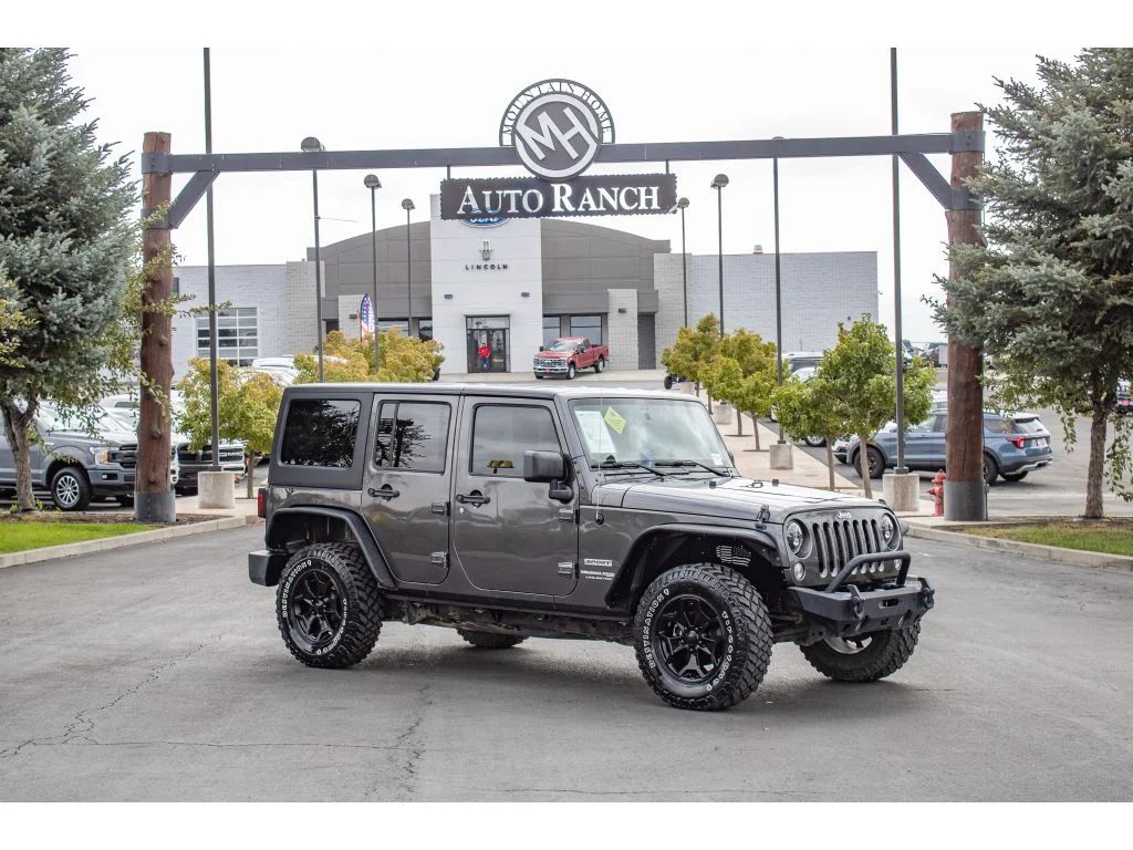 Used 2018 Granite Crystal Metallic Clearcoat Jeep Sport S image 1
