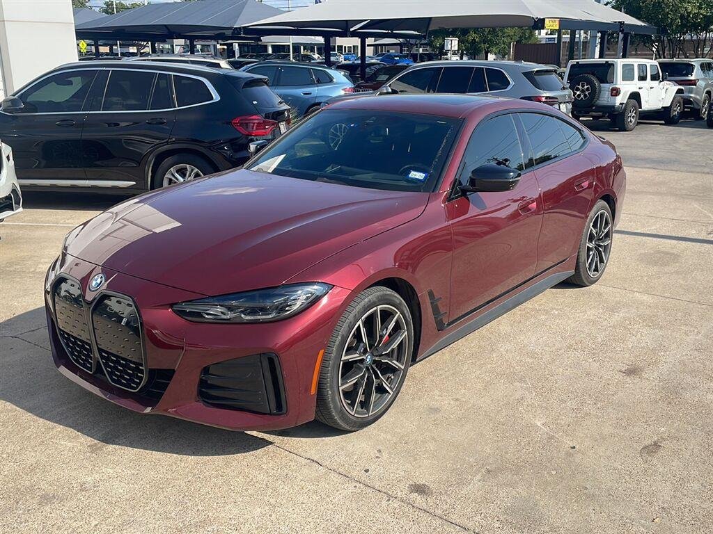 Certified Used 2023 Aventurin Red Metallic BMW eDrive40 image 1