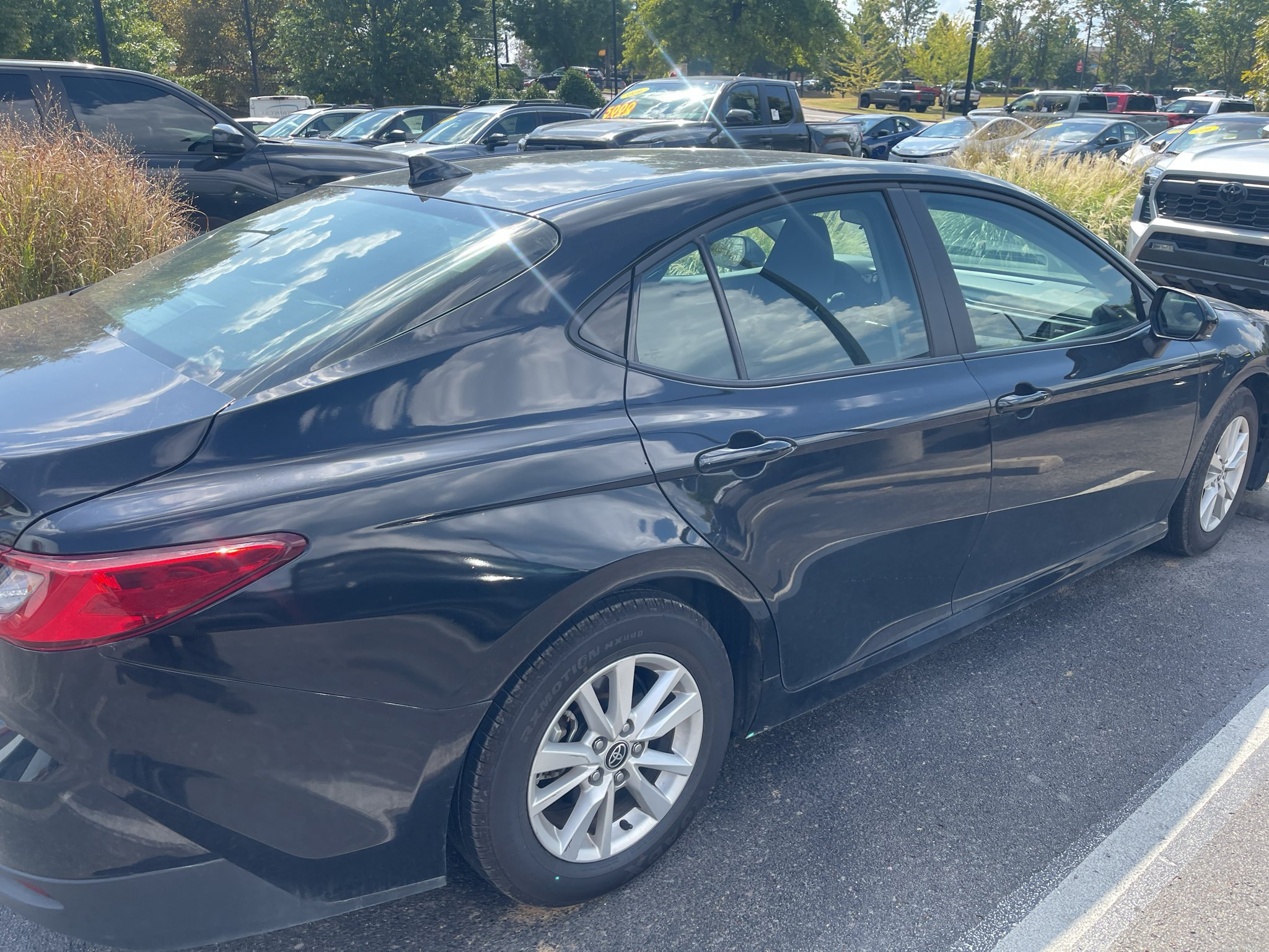 Used 2025 Midnight Black Metallic Toyota LE image 6
