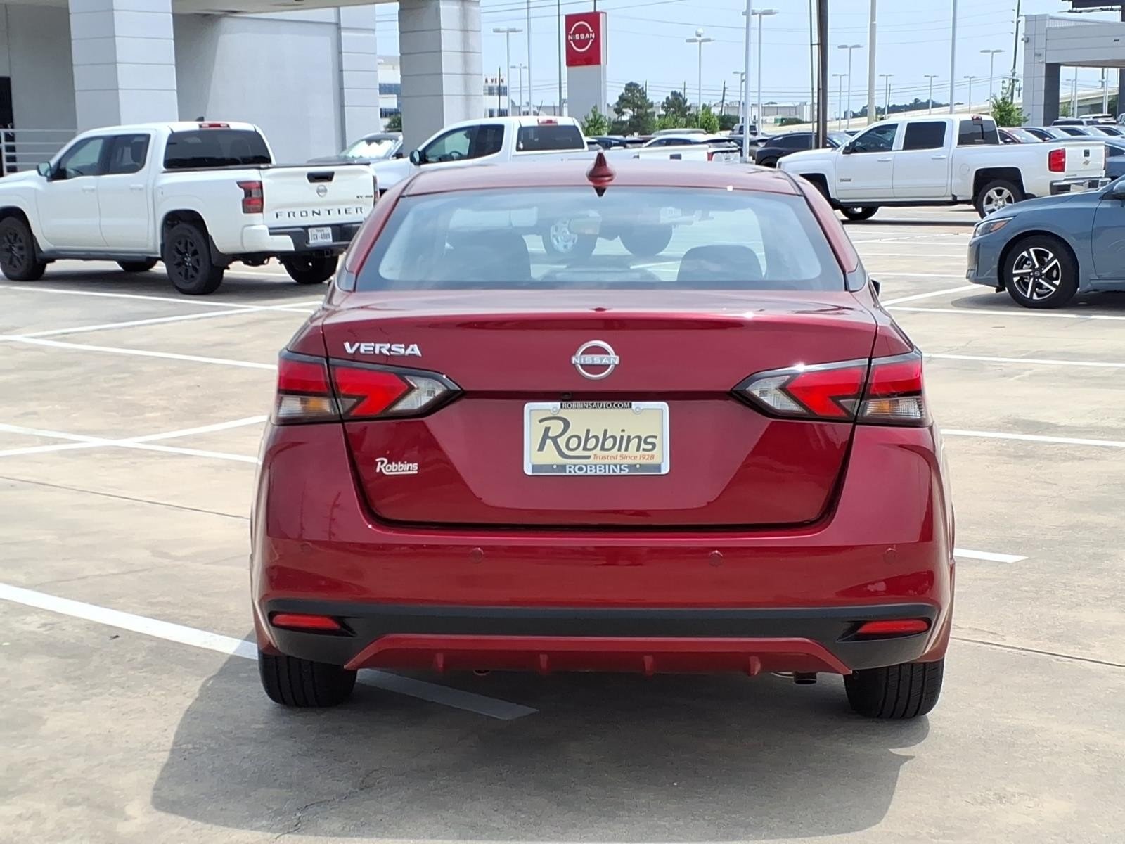 2025 Nissan Versa SV Red at Robbins Nissan