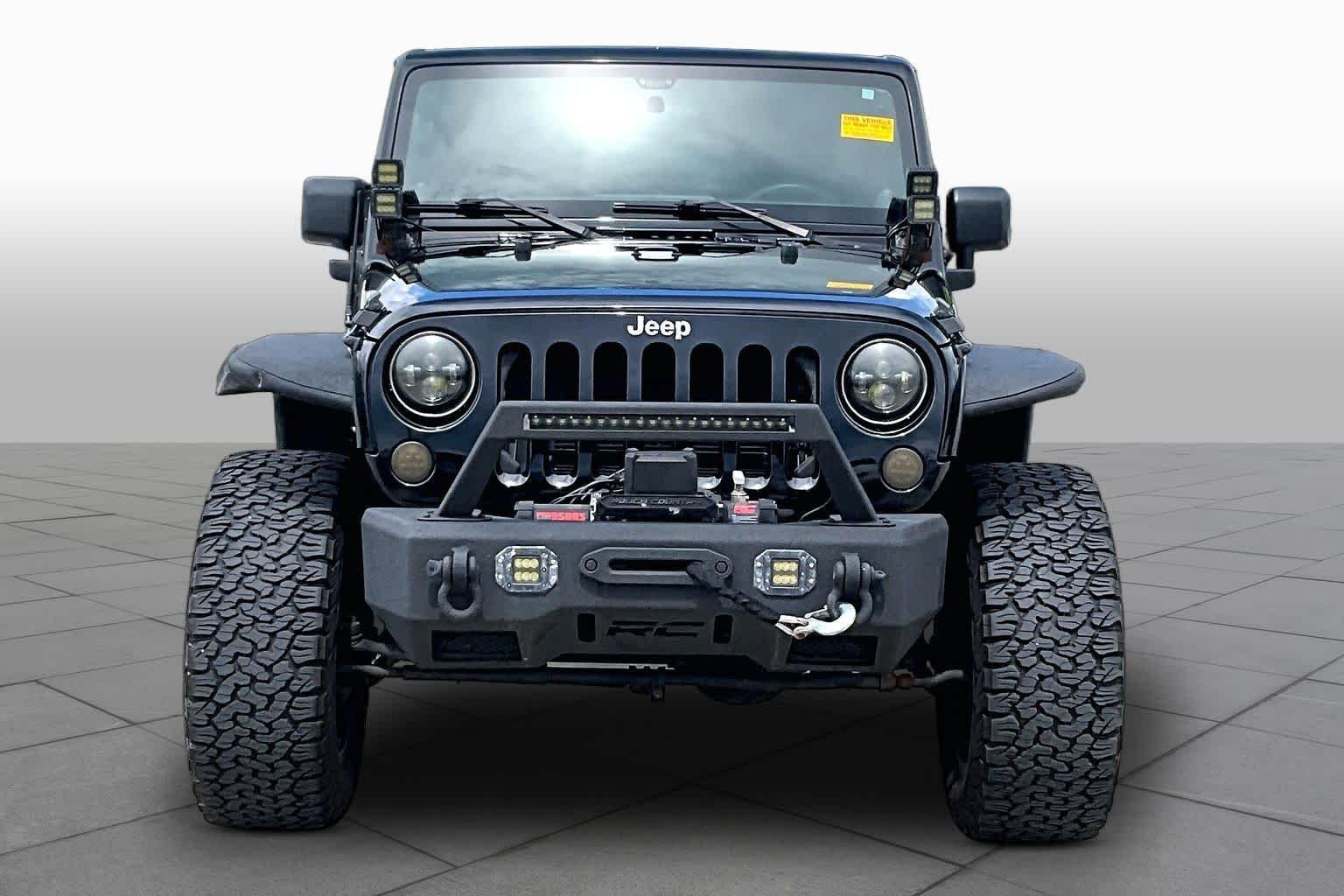 Used 2014 Black Clearcoat Jeep Sport image 4