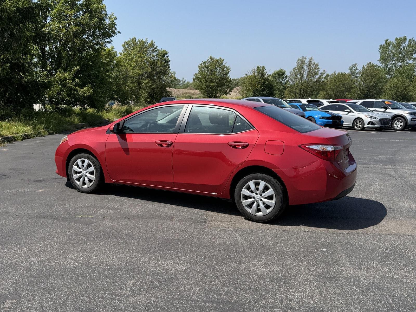 Used 2015 Barcelona Red Metallic Toyota LE image 6