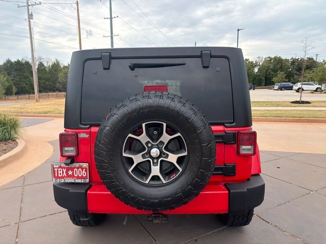 Used 2017 Red Jeep Unlimited Sahara image 4