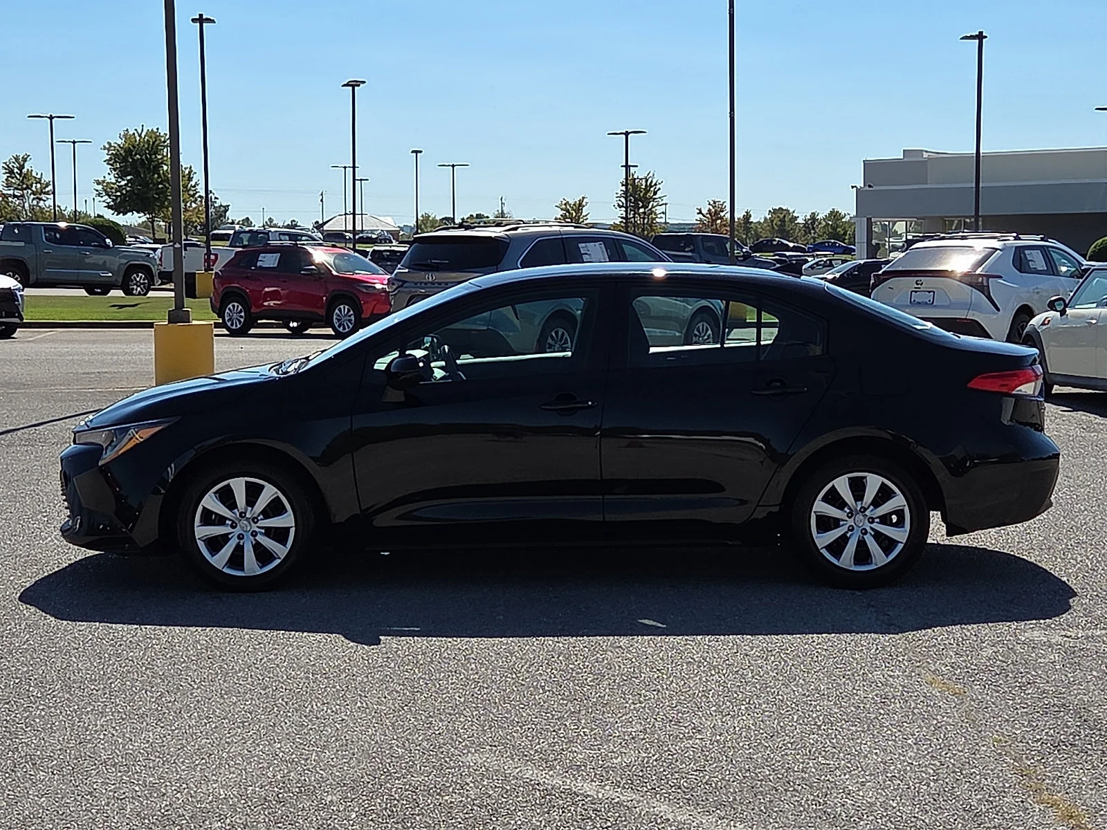 Used 2025 Midnight Black Metallic Toyota LE image 3