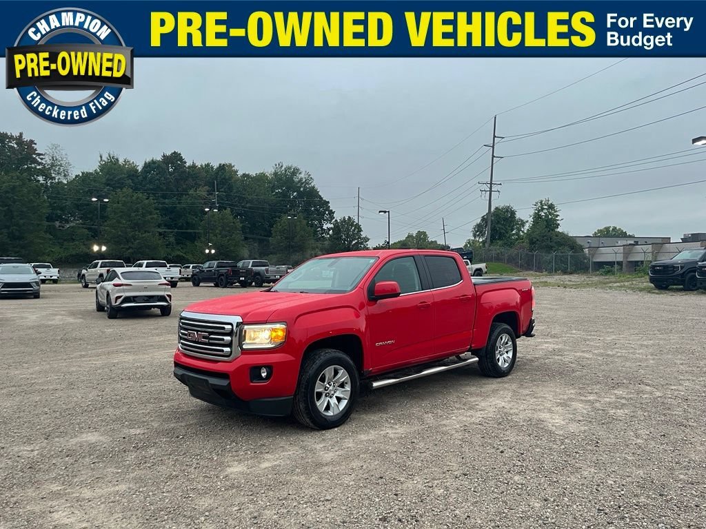 Used 2016 CARDINAL RED GMC 4WD SLE image 1