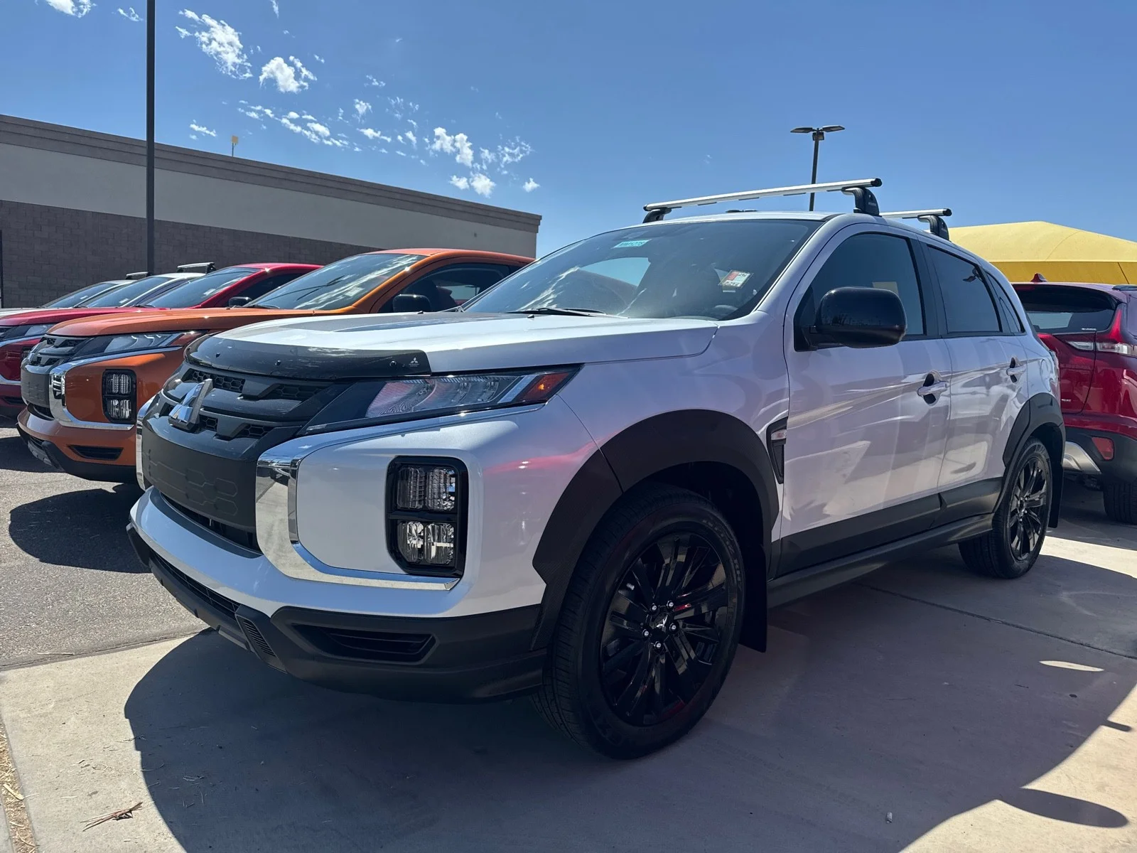 Used 2025 White Diamond Mitsubishi Trail Edition image 1