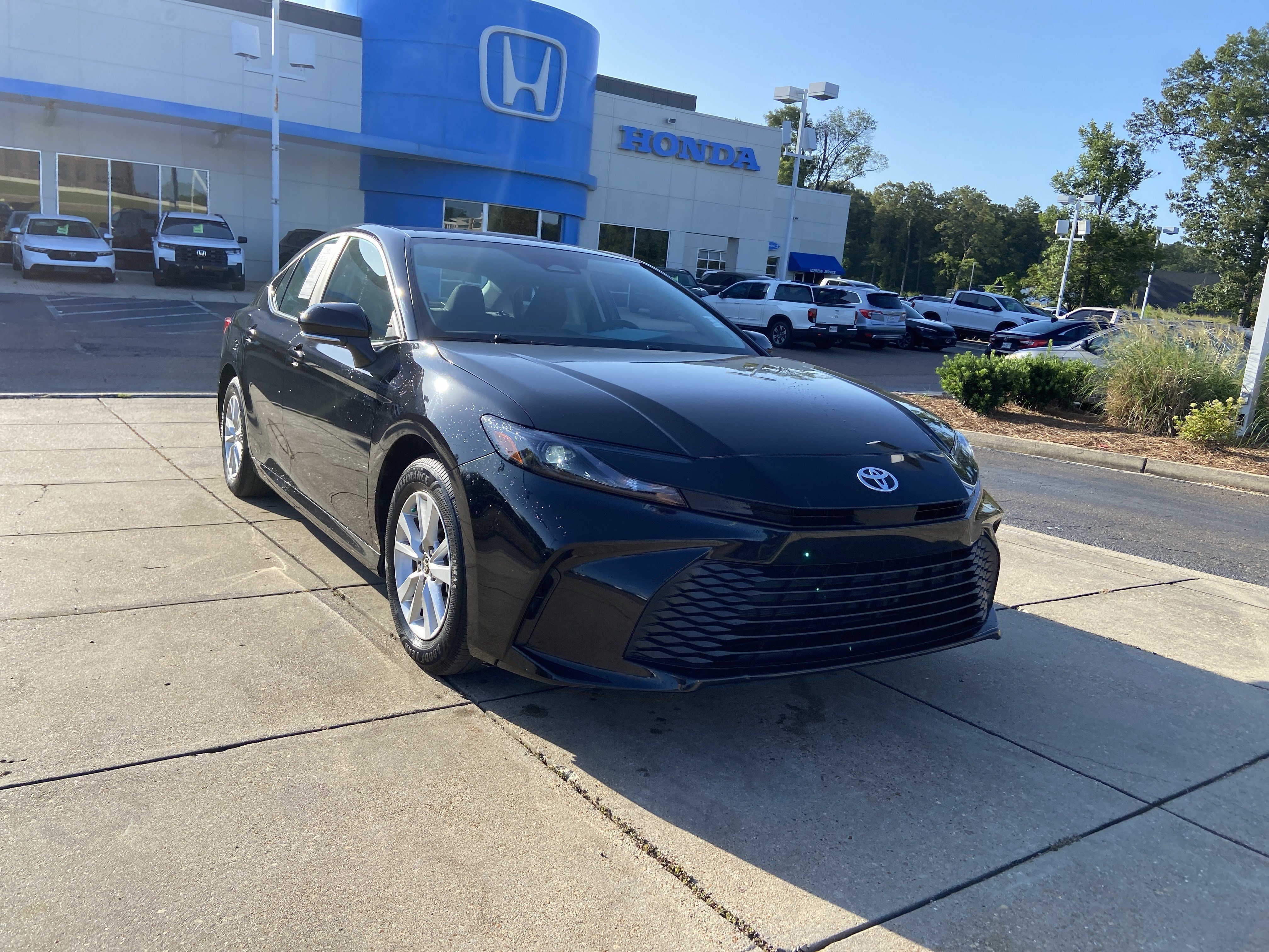 Used 2025 Midnight Black Metallic Toyota LE image 2