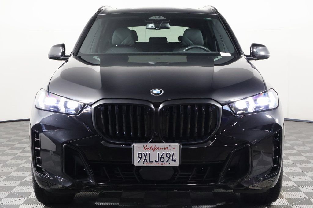Certified Used 2026 Black Sapphire Metallic BMW sDrive40i image 2