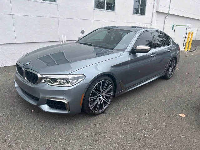 Used 2018 Bluestone Metallic BMW M550i xDrive image 1