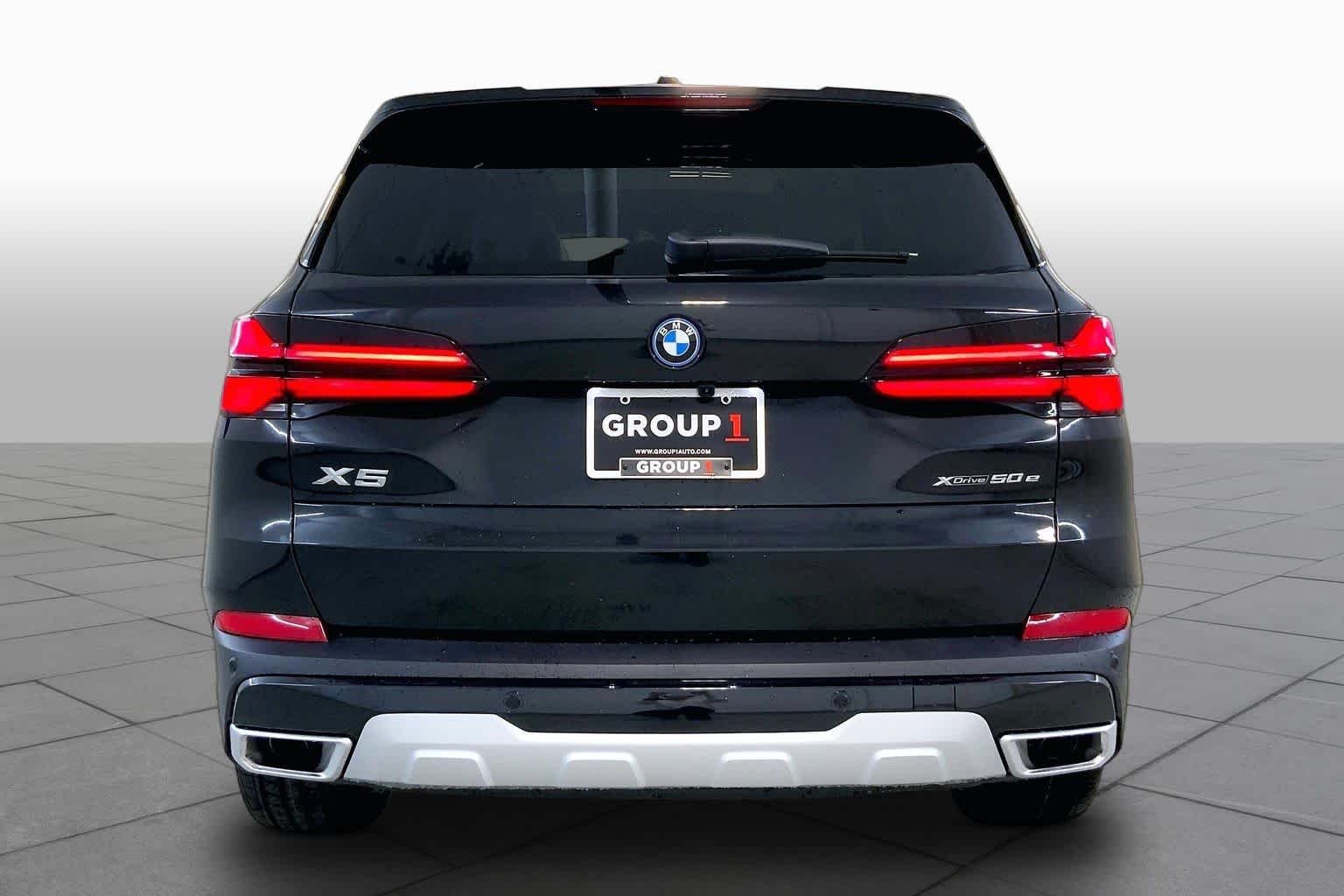 New 2026 Black Sapphire Metallic BMW xDrive50e image 4