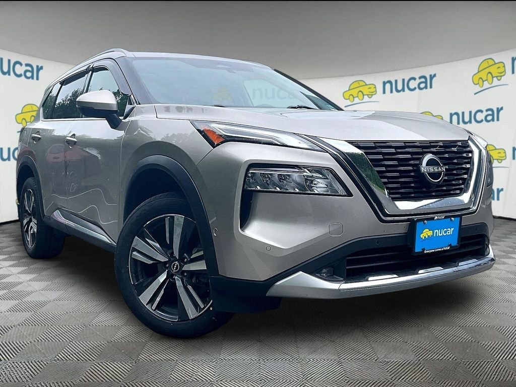 Used 2022 Gold Nissan Platinum image 1