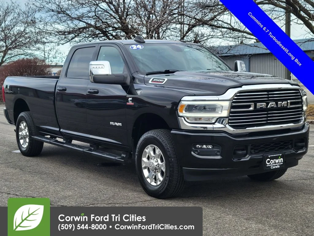 Used 2024 Diamond Black Ram Laramie image 1