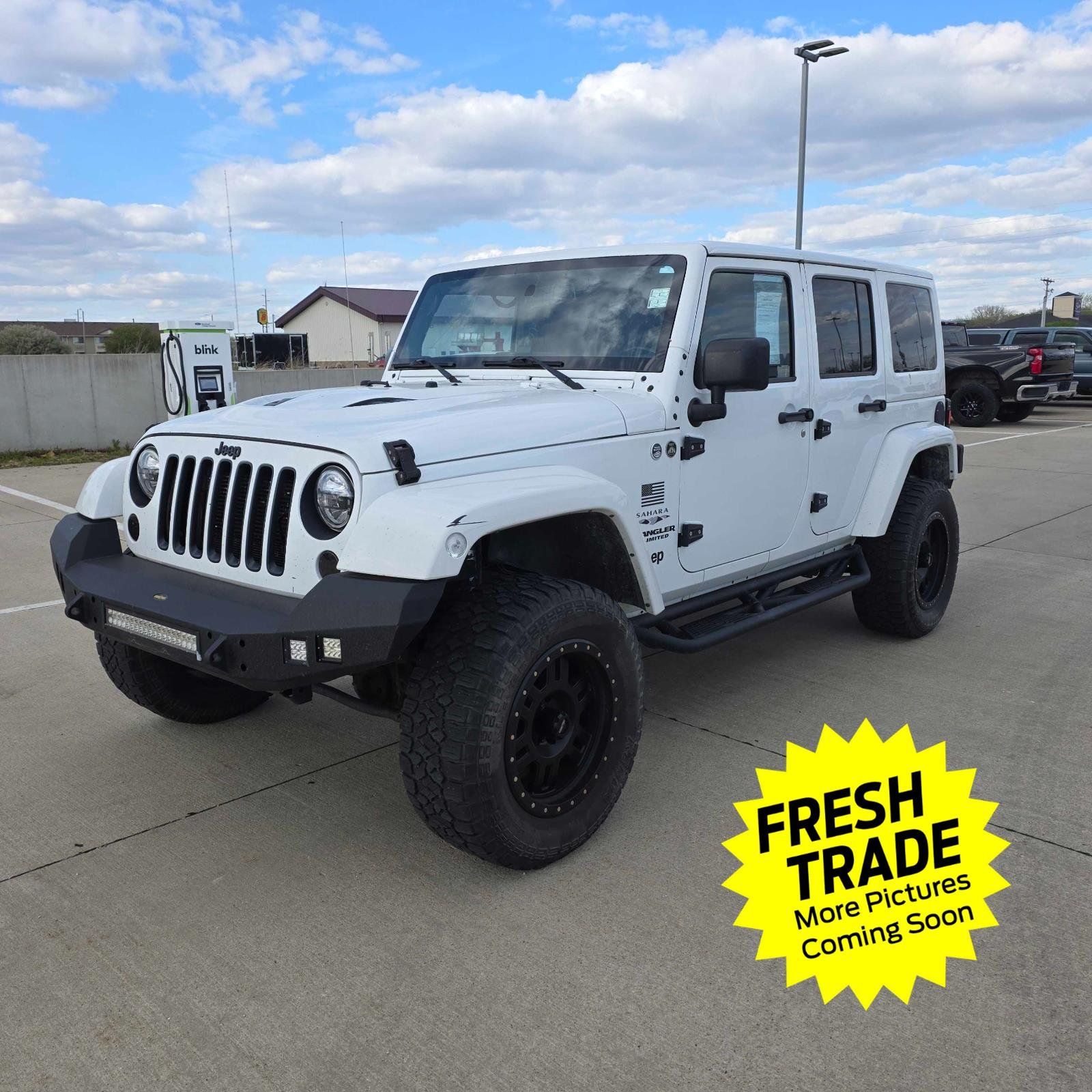 Used 2015 Jeep Wrangler Unlimited Sahara with VIN 1C4BJWEG7FL607941 for sale in Charles City, IA
