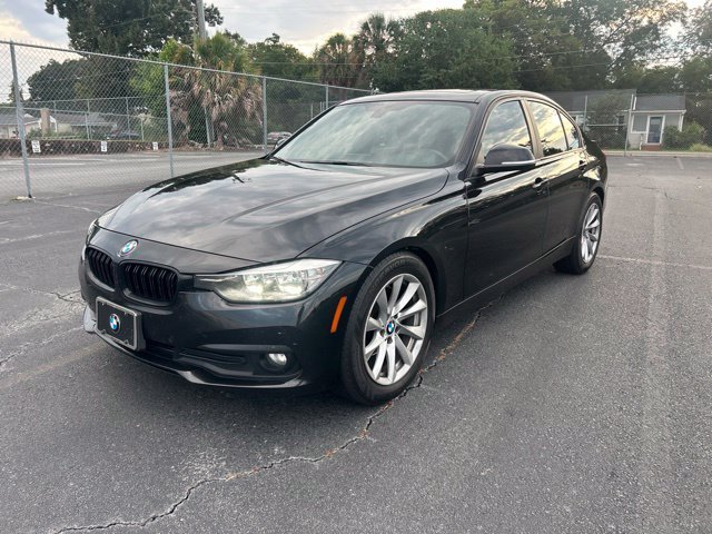 Used 2017 Black BMW 320i xDrive image 1