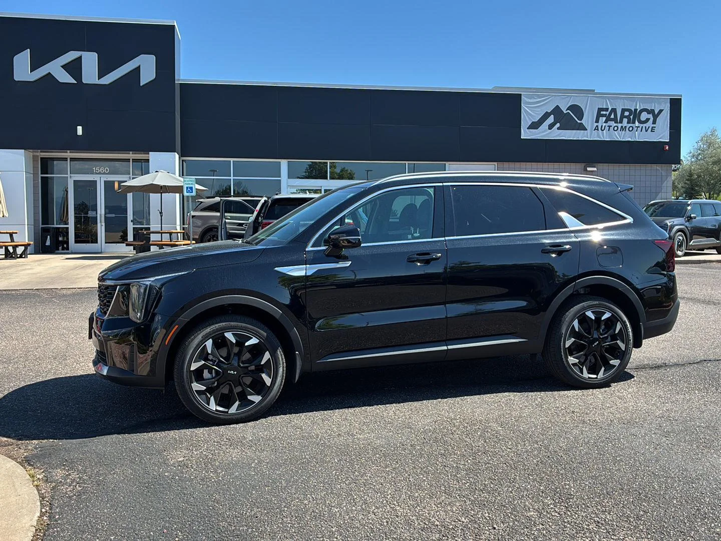 Used 2026 Ebony Black Kia EX image 1