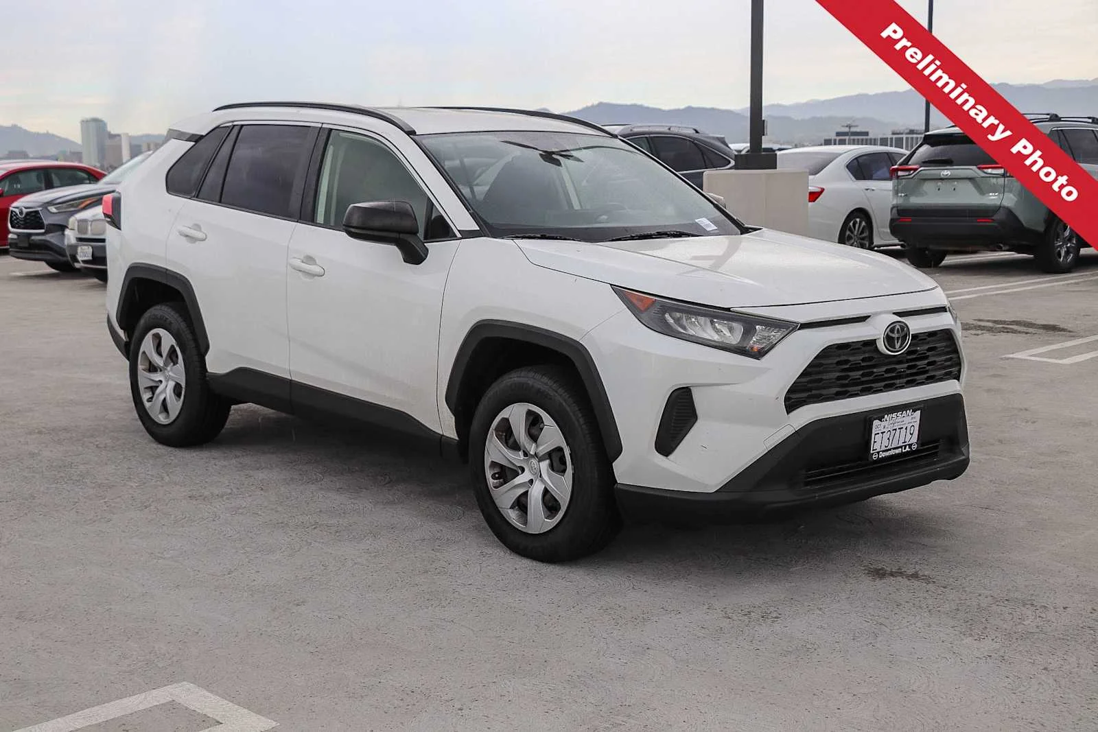 Used 2019 Super White Toyota LE image 3