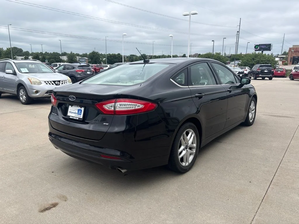 Used 2014 Tuxedo Black Metallic Ford SE image 5