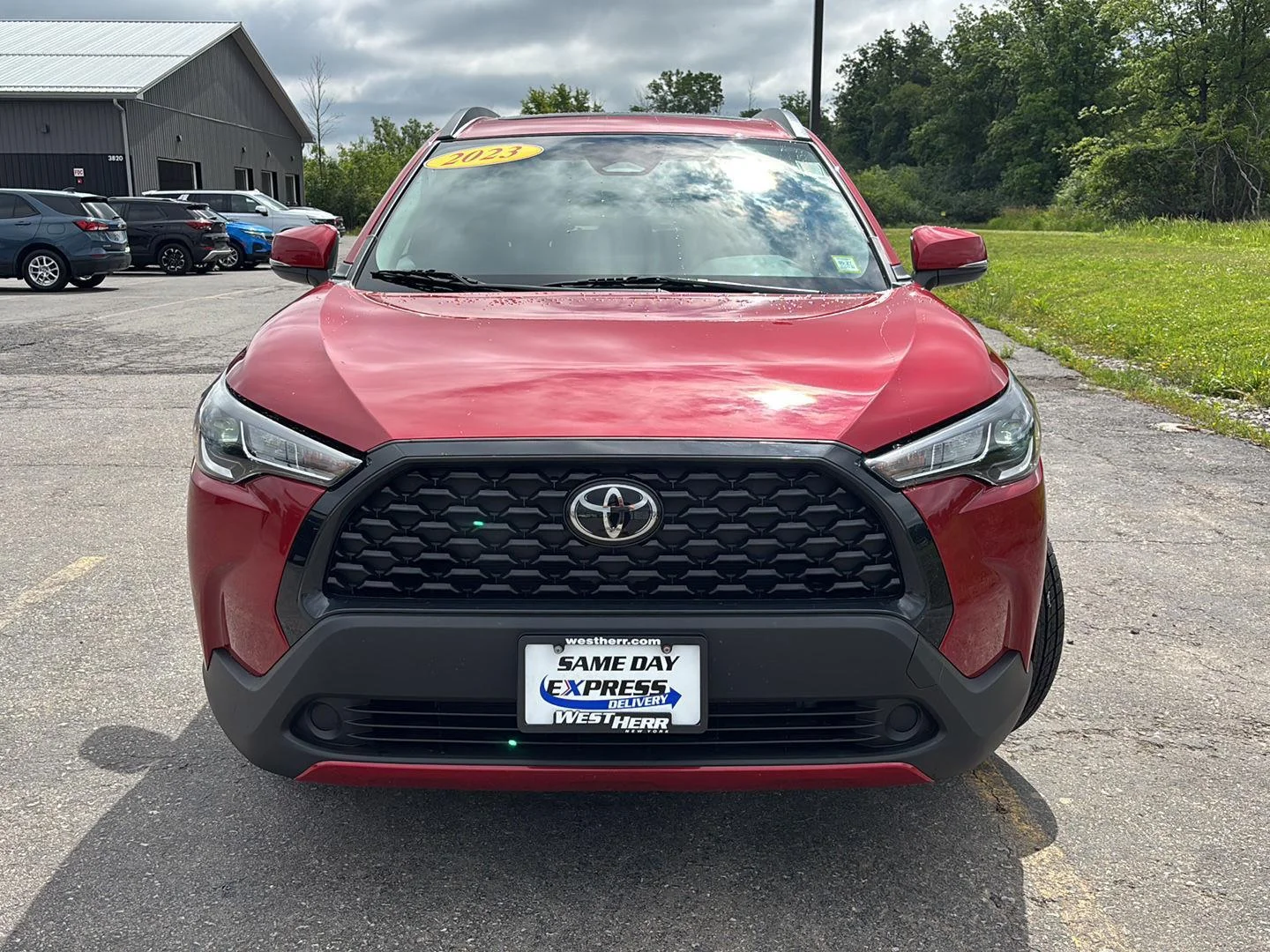 Used 2023 Barcelona Red Metallic Toyota LE image 2